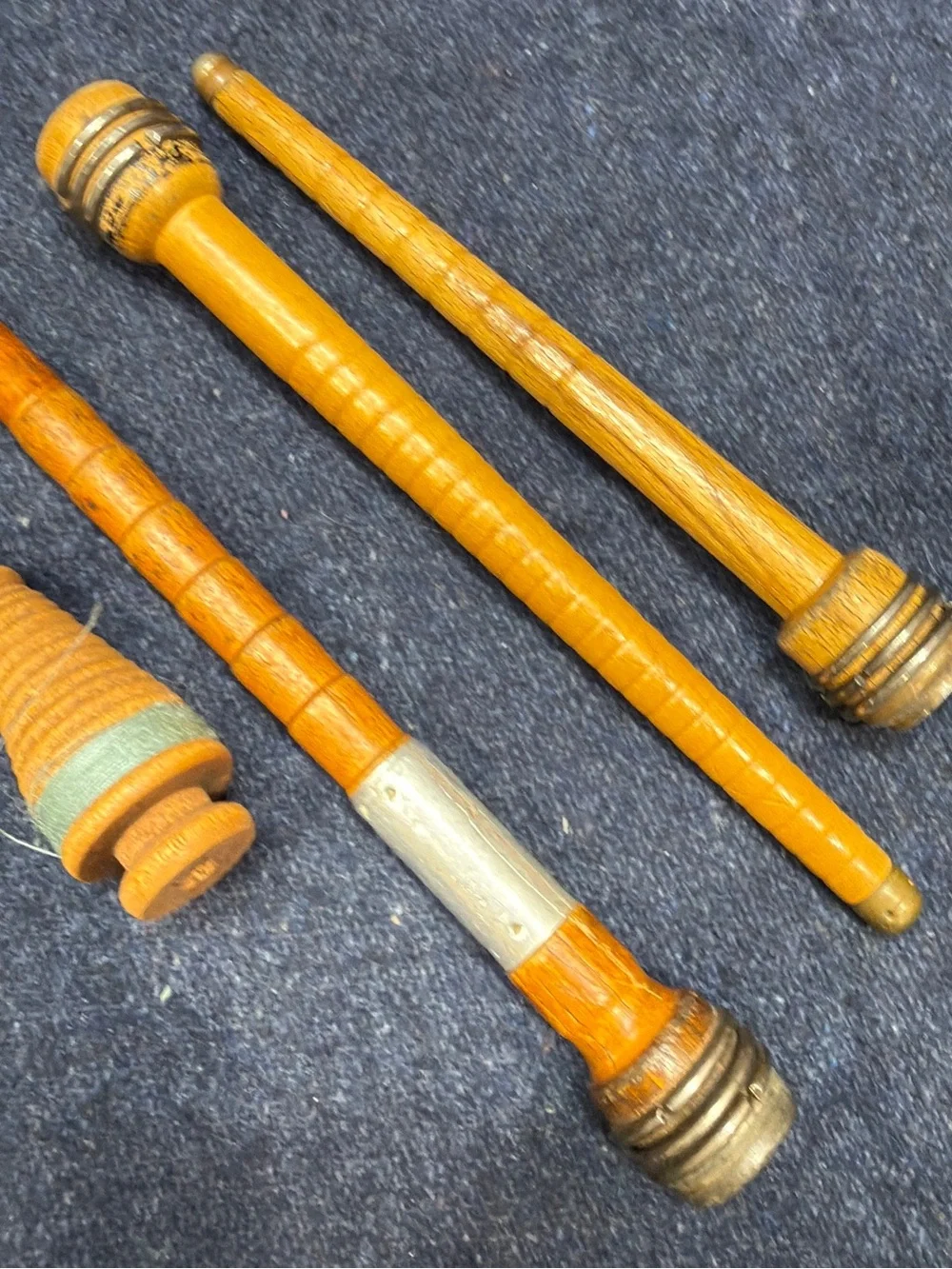 Antique wooden textile mill bobbins quills from industrial loom